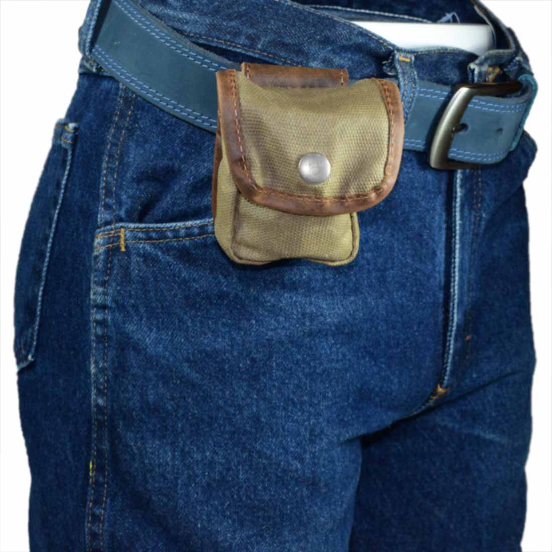 Hide & Drink's Mini Belt Pouch attached to a belt, highlighting its functionality as a utility pouch for hiking and outdoor adventures. This versatile pouch is crafted from water-resistant waxed canvas and is a product of stockyardX's small batch production, proudly hand-cut and hand-sewn by artisans in La Antigua Guatemala & Oaxaca Mexico.
