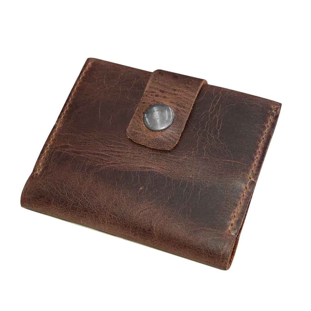 The Squared Wallet by Hide & Drink, beautifully crafted with a durable snap closure, showcasing its Full Grain Leather exterior. This Bifold Simple Wallet is a result of Hand Cut and Hand Sewn methods, emphasizing Small Batch Production.