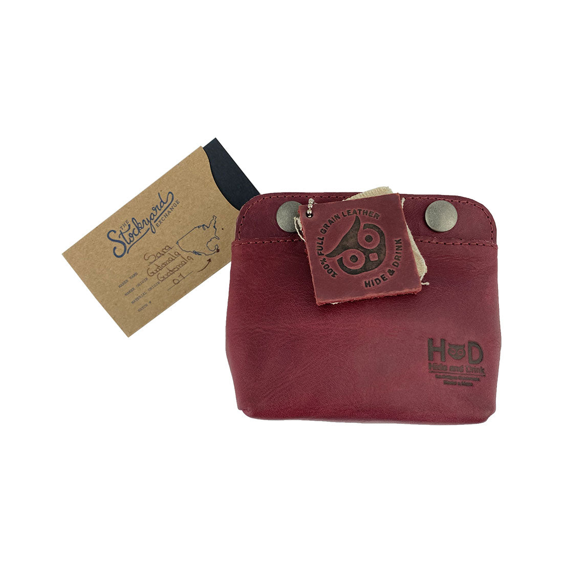 Tag featuring Hide & Drink Double Snap Pouch emphasizing its artisanal quality and craftsmanship. This full grain leather piece is designed for practical use as a cash & card holder or coin purse, made in La Antigua Guatemala.
