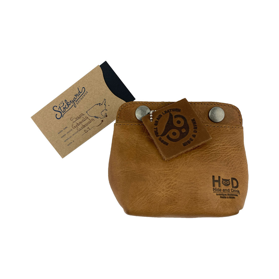 Tag showcasing the Hide & Drink Double Snap Pouch, perfect for organizing cash and cards while emphasizing its artisanal quality from La Antigua Guatemala. Made with full grain leather.