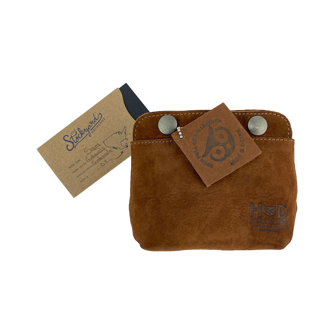 Stylish image of the Hide & Drink Double Snap Pouch with the brand tag, emphasizing its versatility as a cash & card holder and makeup organizer. High-quality full grain leather, handmade in La Antigua Guatemala for durability.