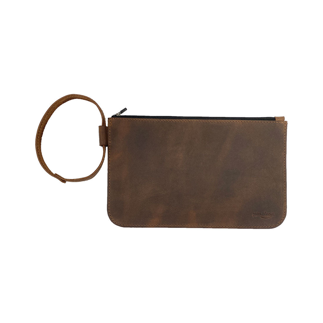 Heather's Rustic Clutch Bag showcasing a stylish design, perfect for storing small valuables during travel. This unique accessories pouch is made from durable full grain leather, making it ideal for makeup, cosmetics, and toiletries. This handmade item reflects small batch production, featuring hand cut and hand sewn craftsmanship, fire branded for authenticity. Artisan quality from La Antigua Guatemala & Oaxaca Mexico.
