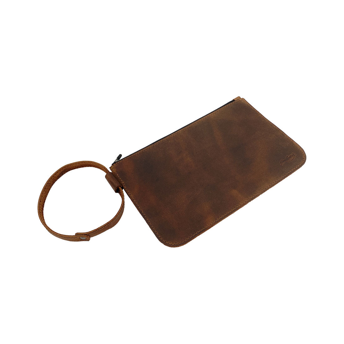 Angled view of Heather's Rustic Clutch Bag, showing its sophisticated design and premium full grain leather. This versatile travel case serves as an accessories pouch for makeup and toiletries, boasting artisan craftsmanship with hand cut and hand sewn features. Each bag is fire branded for authenticity, highlighting small batch production from La Antigua Guatemala & Oaxaca Mexico.