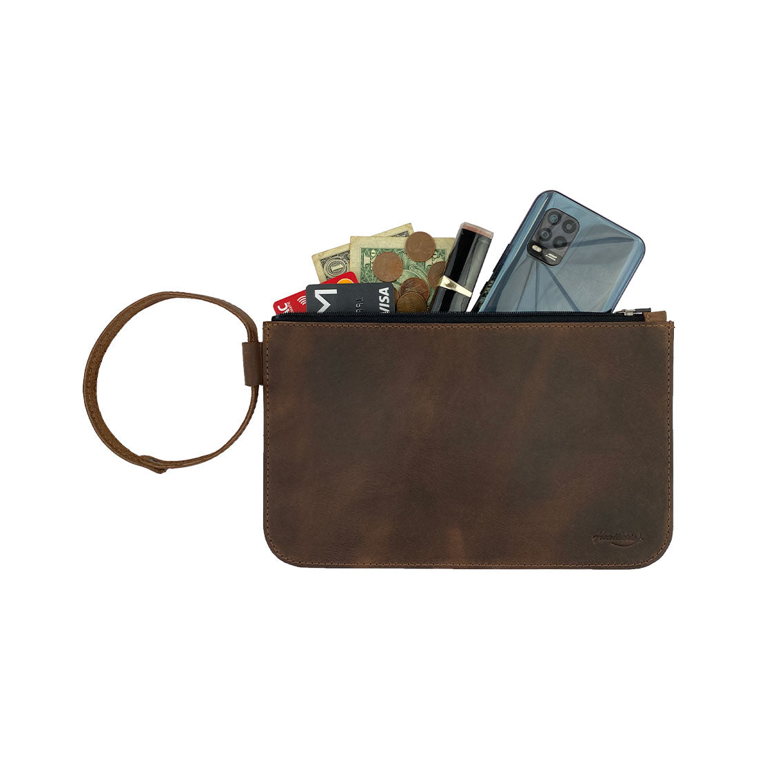 Open view of Heather's Rustic Clutch Bag filled with essentials like cash and phone. This versatile accessories pouch is perfect to store small valuables while traveling. Crafted from durable, full grain leather, this handmade bag showcases the artisan quality of small batch production, featuring hand cut, hand sewn, and fire branded elements, made in La Antigua Guatemala & Oaxaca Mexico.