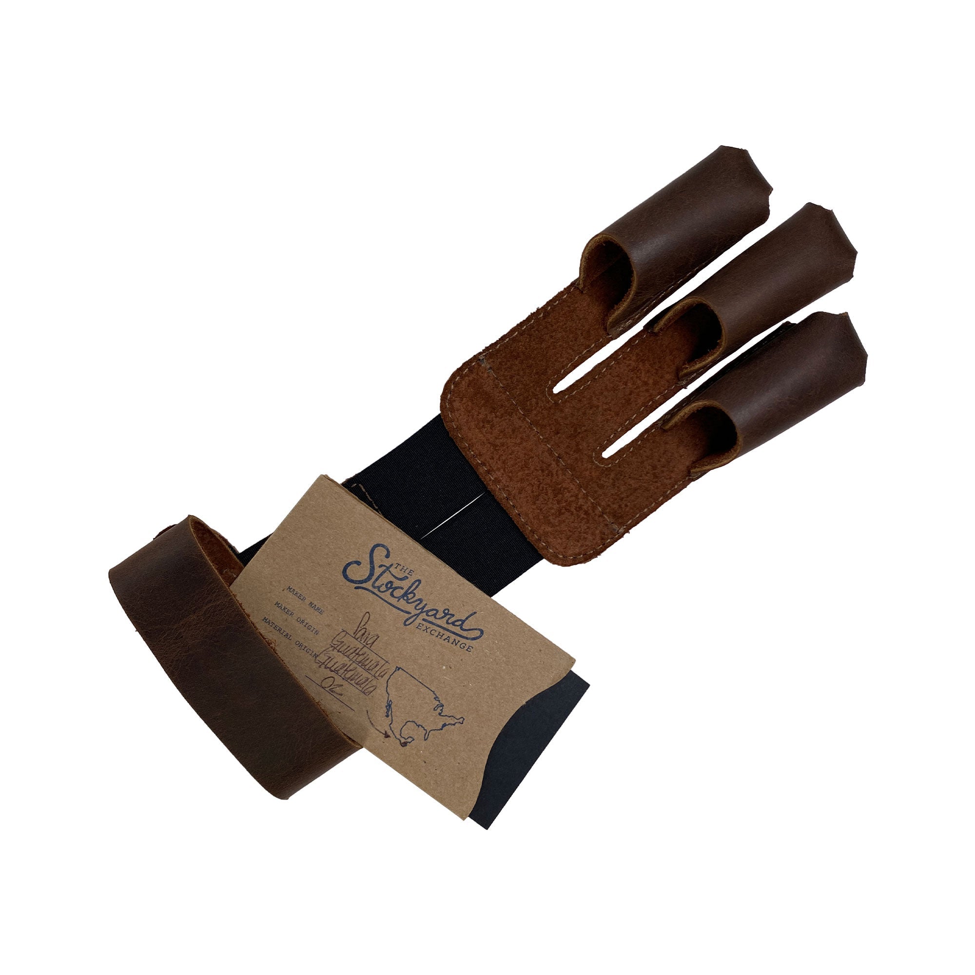 Valhalla Gear Three-Finger Archery Glove with its tag, highlighting its full grain leather craftsmanship. This accessory is perfect for archers engaged in target practice, providing essential protection for wrist and fingers during bow and arrow shooting. Celebrating artisan skills, this handmade product features small batch production, hand cut, hand sewn details, and is fire branded, made in La Antigua Guatemala & Oaxaca Mexico.