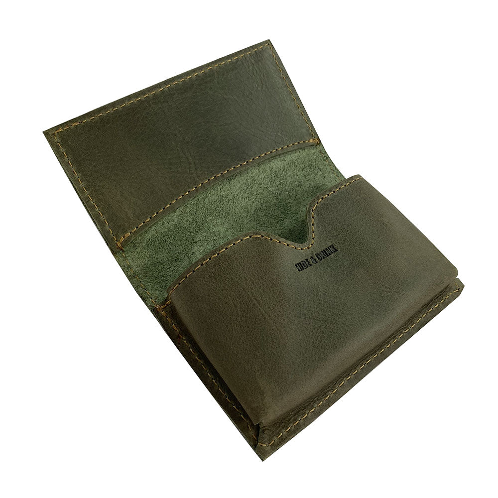Hide & Drink's Vintage Card Holder with cards and cash visible, illustrating its dual function as a wallet and business card holder. Made from full grain leather, this pocket accessory reflects the artisan craftsmanship from La Antigua Guatemala & Oaxaca Mexico.