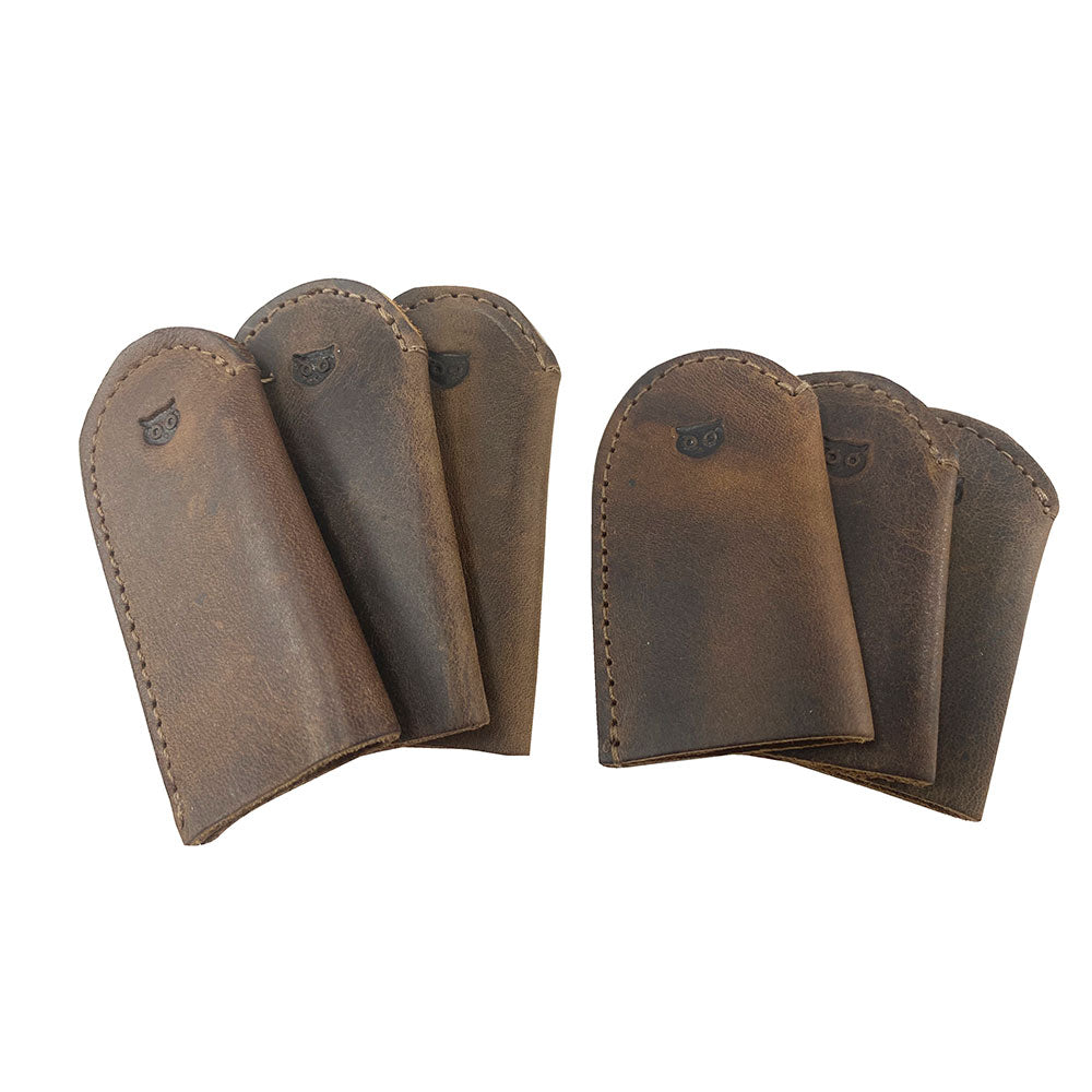 Leather Thimble for Thumb & Index Finger (3 Paires) by Hide & Drink presenting a set of 3 pairs (6 pieces) of thimbles. Ideal for finger protection while sewing, hand appliqué, EPP, and quilting, these thimbles feature luxurious full grain leather. StockyardX offers these artisan, handmade leather thimbles, skillfully hand cut and hand sewn, with a fire branded touch, crafted in La Antigua Guatemala & Oaxaca Mexico.