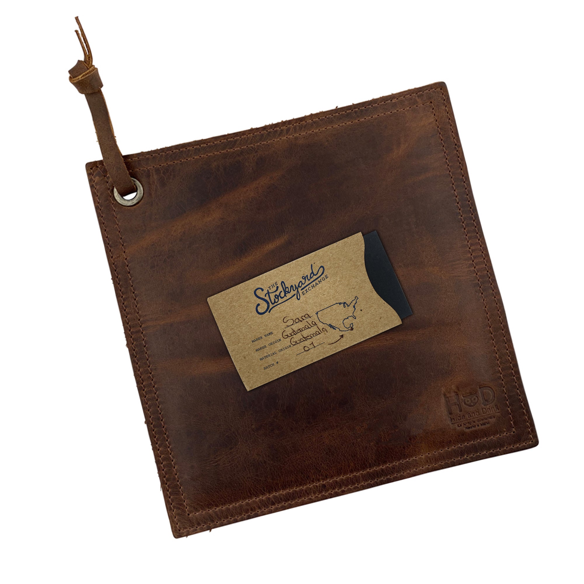 Dimensions of the Hide & Drink Pot Pad shown for potential buyers. This rustic leather pot holder is handcrafted for durability and practicality in the kitchen.