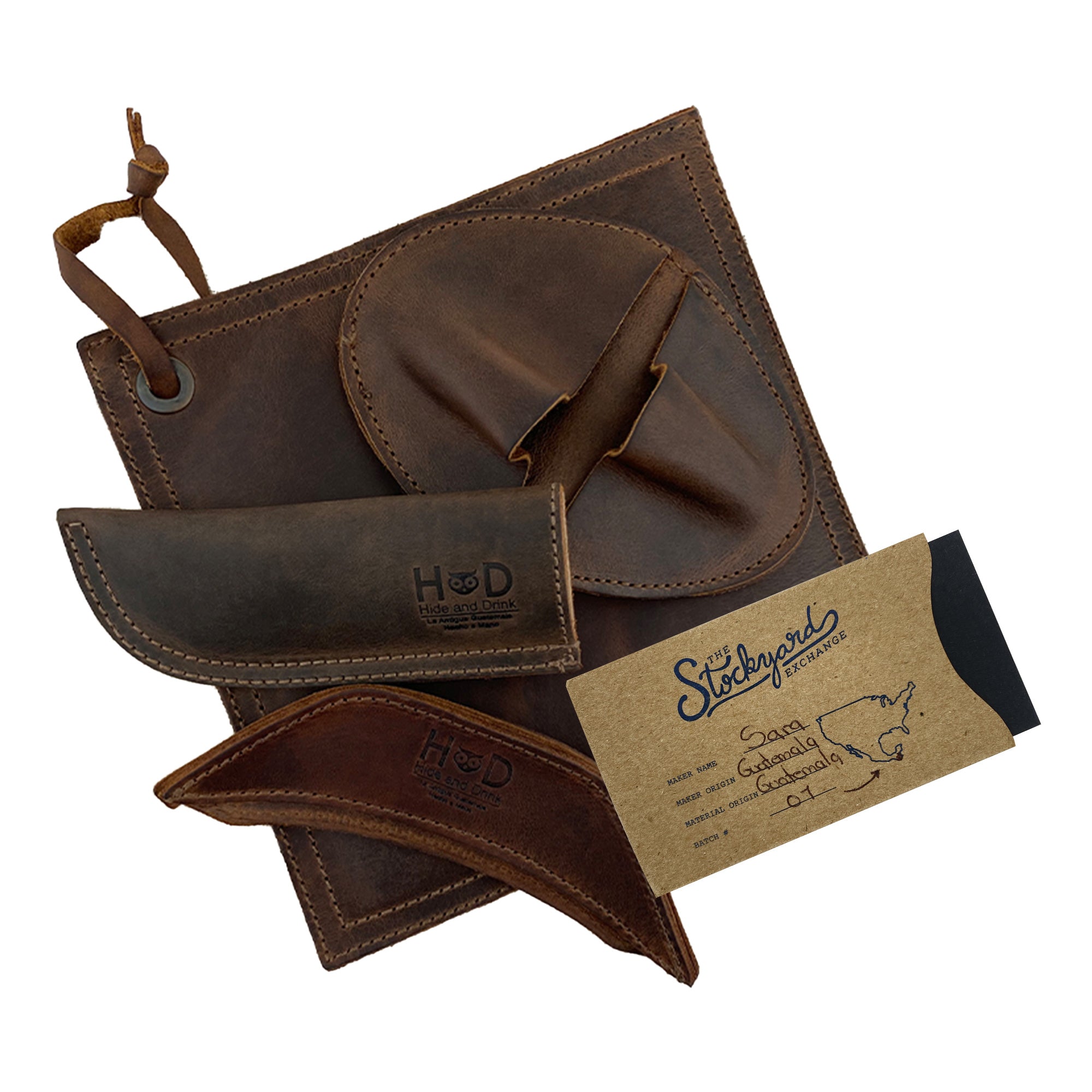 The Hide & Drink Hot Handle Holders (Set of 4) are elegantly displayed, including the Panhandle, Side Kick, Grip Mitt, and Square Pot Holder. Made from high-quality Full Grain Leather, these artisan pieces are a testament to small batch production techniques, hand cut and hand sewn by skilled artisans in La Antigua Guatemala & Oaxaca Mexico.