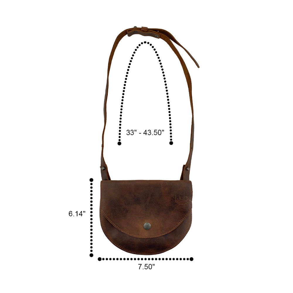 Measurement display of the Hide & Drink Hip and Shoulder Bag, emphasizing its dimensions and Full Grain Leather construction. This artisan piece represents Small Batch Production through meticulous hand cut and hand sewn techniques. Handmade in La Antigua Guatemala & Oaxaca Mexico.