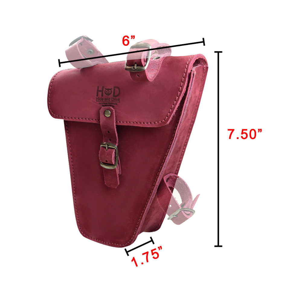 Hide & Drink's red Frame Bag For Bicycle presented with a tag, emphasizing its artisan quality and small batch production. This Full Grain Leather bike tool pouch is perfect for bikers looking for durability and style, handmade in La Antigua Guatemala & Oaxaca Mexico.