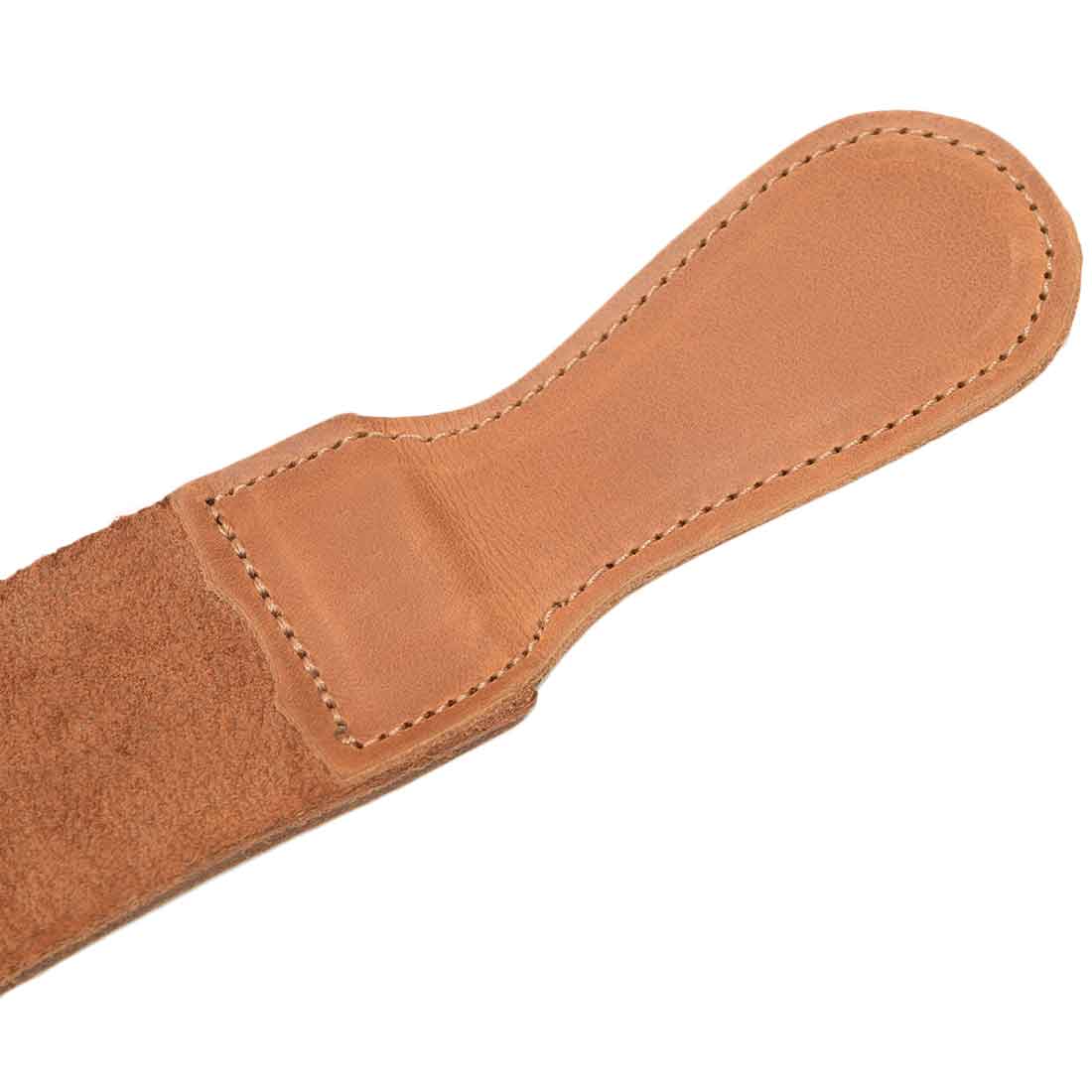 Detailed view of the handle on Hide & Drink's Barber Strop made of premium Full Grain Leather. This shaving sharpener, known as a Razor Strop, shows the dedication to artisan craftsmanship in its handmade design.
