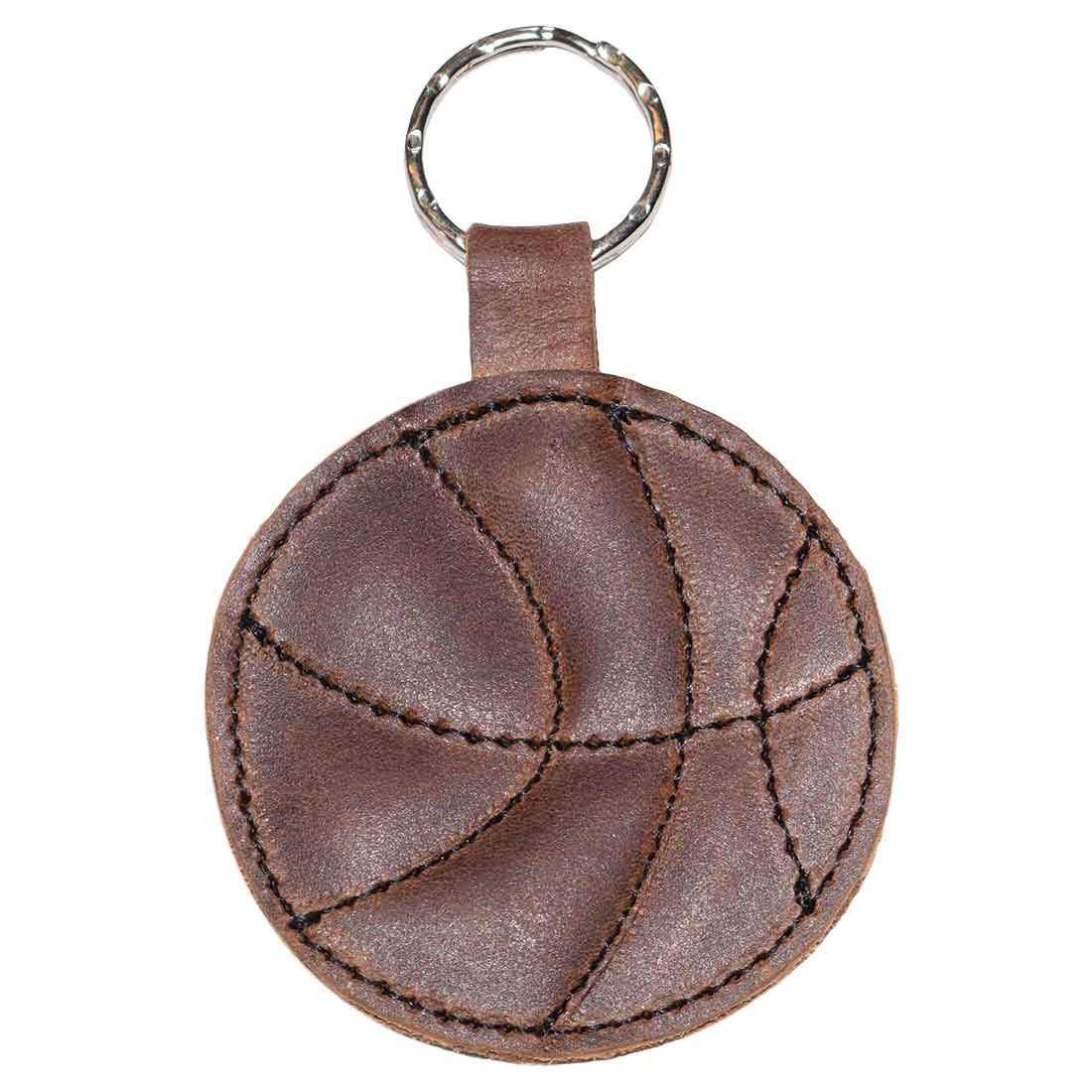 Close-up of the Basketball Keychain by Hide & Drink, highlighting its unique leather stitching and circular basketball shape. A stylish key ring for sports enthusiasts and a thoughtful gift for players, crafted from high-quality full grain leather.