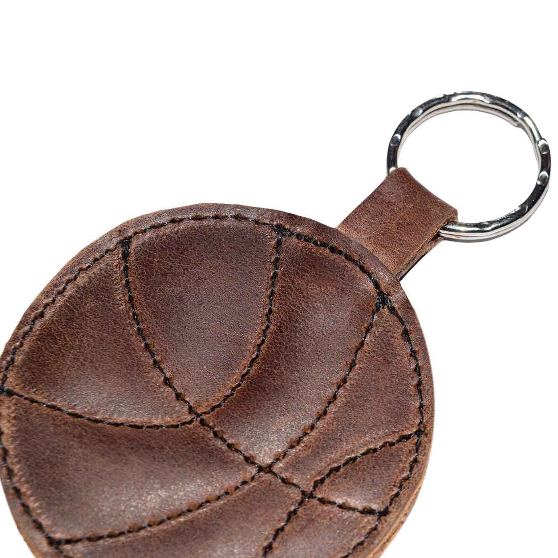Top view of the Basketball Keychain by Hide & Drink, showcasing its leather texture and craftsmanship. An essential accessory for sports fans and a perfect gift for players, made from durable full grain leather in small batch production.