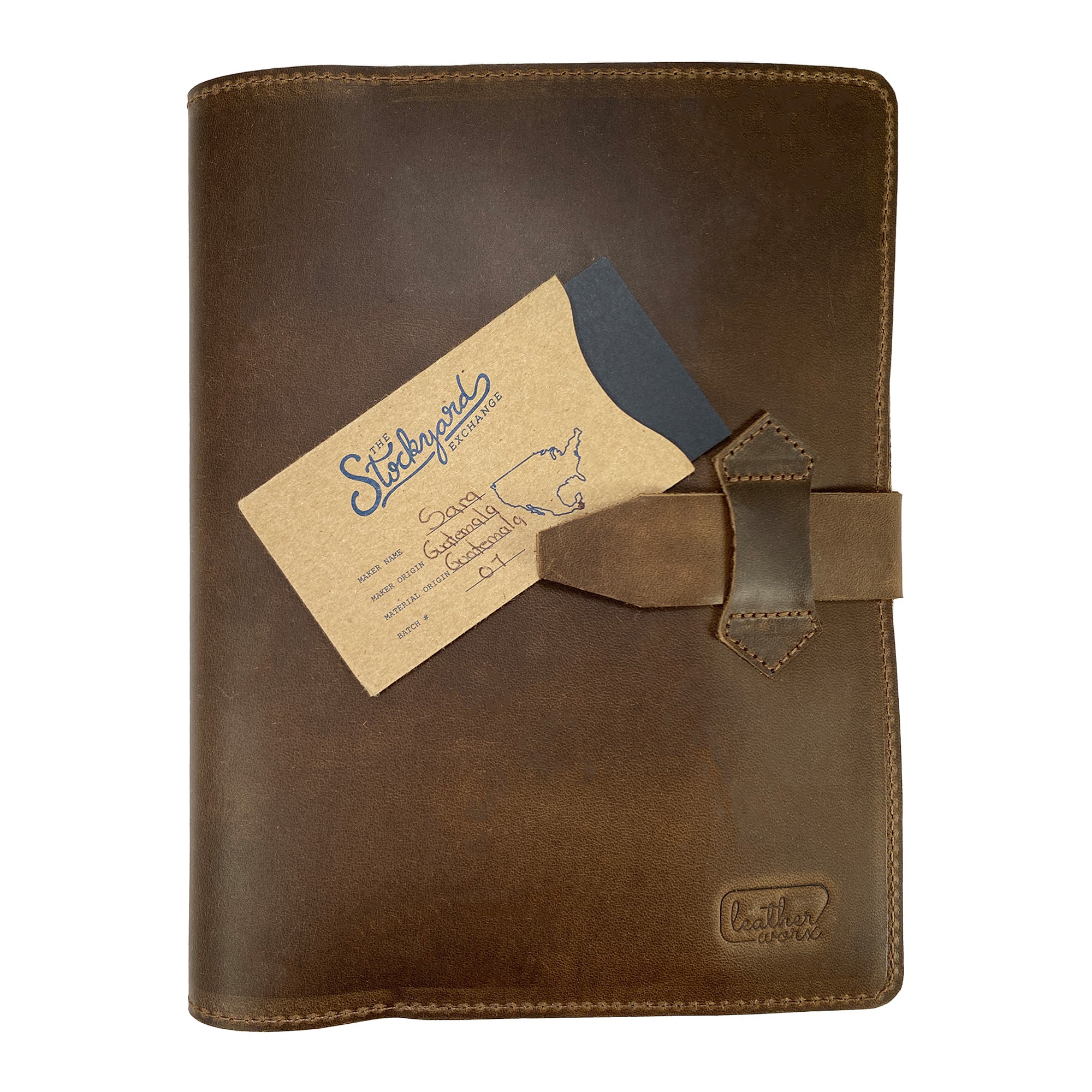 Leather Worx Notepad Cover with a business card tucked inside, reflecting its practical design. This Notepad Cover is made from high-quality full grain leather, focusing on durability and an elegant, minimalist style, handcrafted in La Antigua Guatemala.