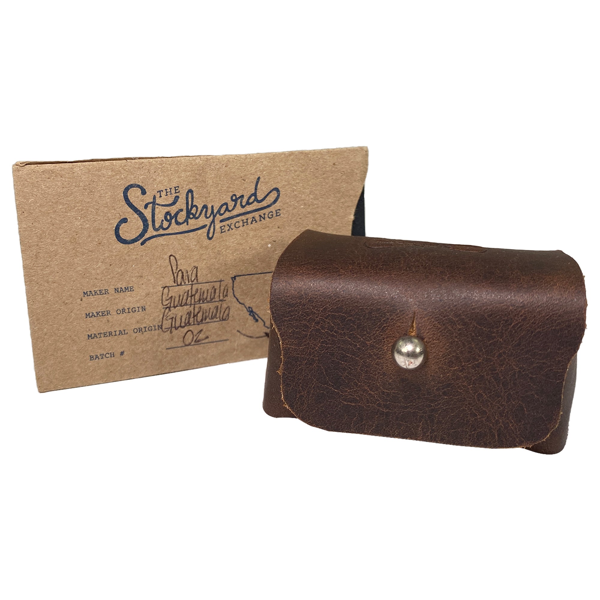 The rustic cufflinks case by Hide & Groom displayed with packaging, illustrating its artisan craftsmanship and branding. A stylish solution for organizing men's accessories like shirt studs, perfectly designed for durability. Rustic Cufflinks Case - Protective Storage for Shirt Studs, Men's Accessories, Full Grain Leather, StockyardX, Small Batch Production, Hand Cut, Hand Sewn, Fire Branded, Artisan, Handmade in La Antigua Guatemala & Oaxaca Mexico.