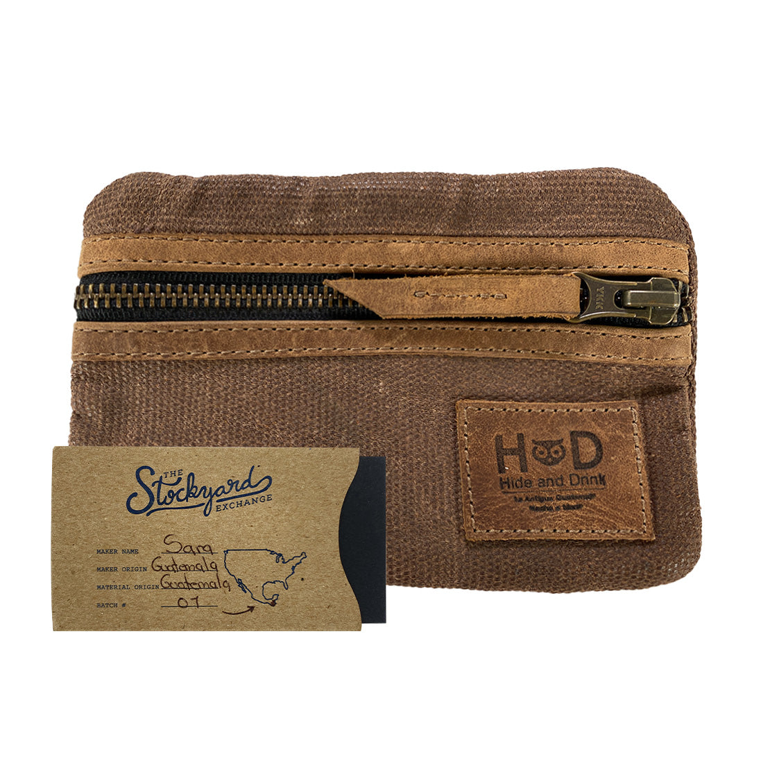 Packaging of the brown Multi-tool Pocket Pouch by Hide & Drink, featuring tags that indicate its artisan production and high-quality materials.
