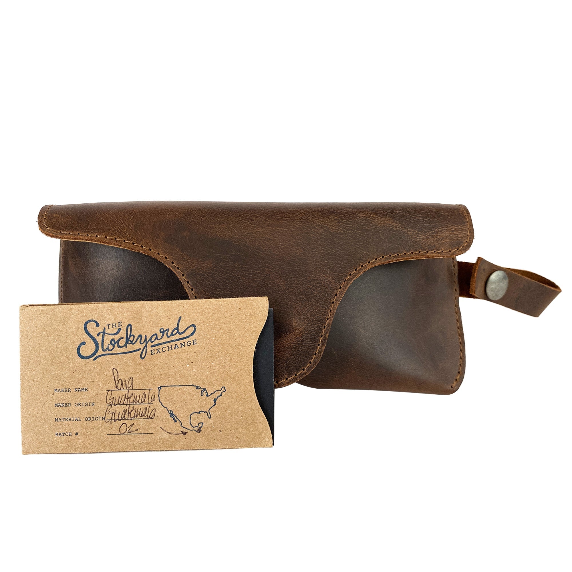 Eyeglasses Case with Strap by Hide & Drink accompanied by packaging, representing a thoughtful gift option. Made from premium full grain leather, this sunglasses case is a stylish protector for eyewear, handmade in La Antigua Guatemala & Oaxaca Mexico.