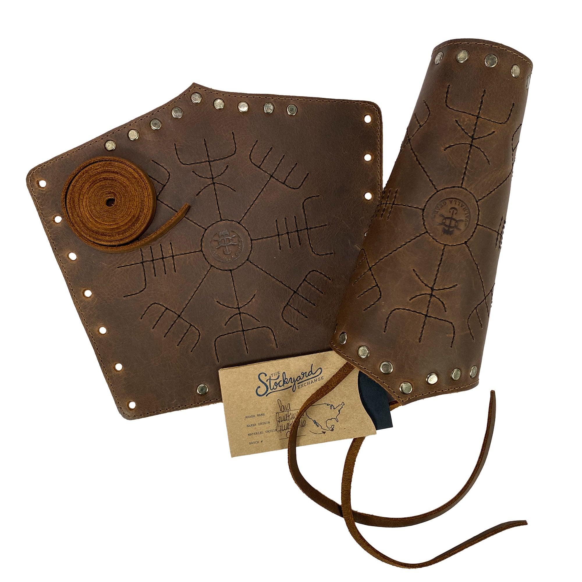 Viking Bracer set from Valhalla Gear displayed with tags detailing its origin and artisan process. This Viking Bracer (2 pack) exemplifies durable wrist guards meant for archery, featuring small batch production techniques. Crafted in La Antigua Guatemala, these full grain leather protectors proudly showcase their handmade heritage.