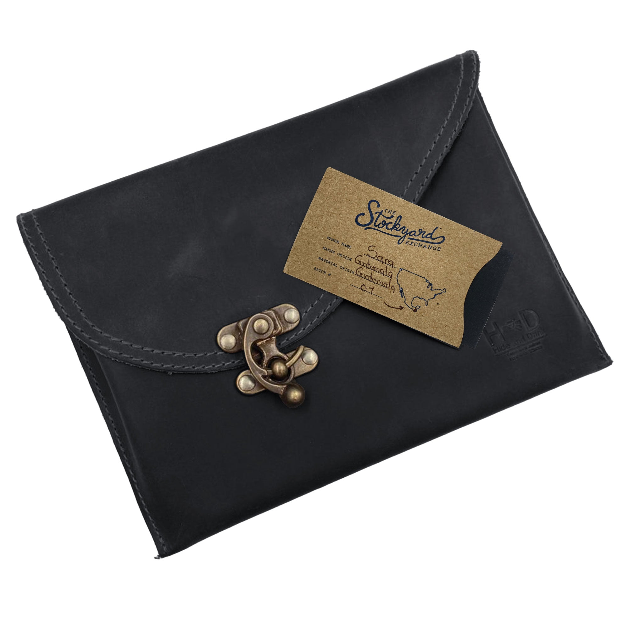 Pricing and details tag attached to the black Vintage Clutch Bag by Hide & Drink, emphasizing full-grain leather and artisan quality from small batch production in Oaxaca Mexico.