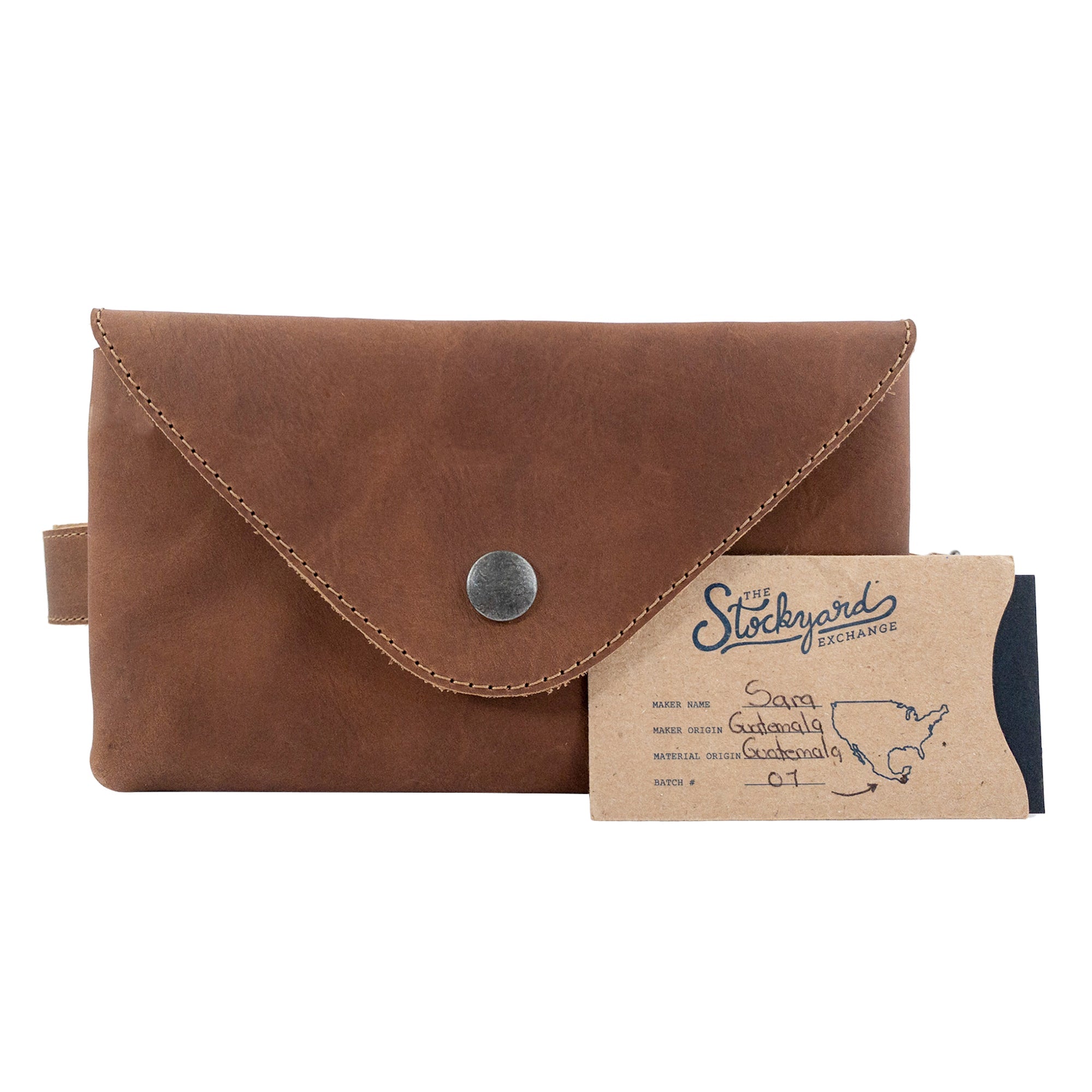 Hide & Drink's Fancy Fanny Pack in rich brown, featured with brand tags, exemplifying quality and craftsmanship. Made from full grain leather, this artisan waist pouch is great for travel and serves as a vintage purse.