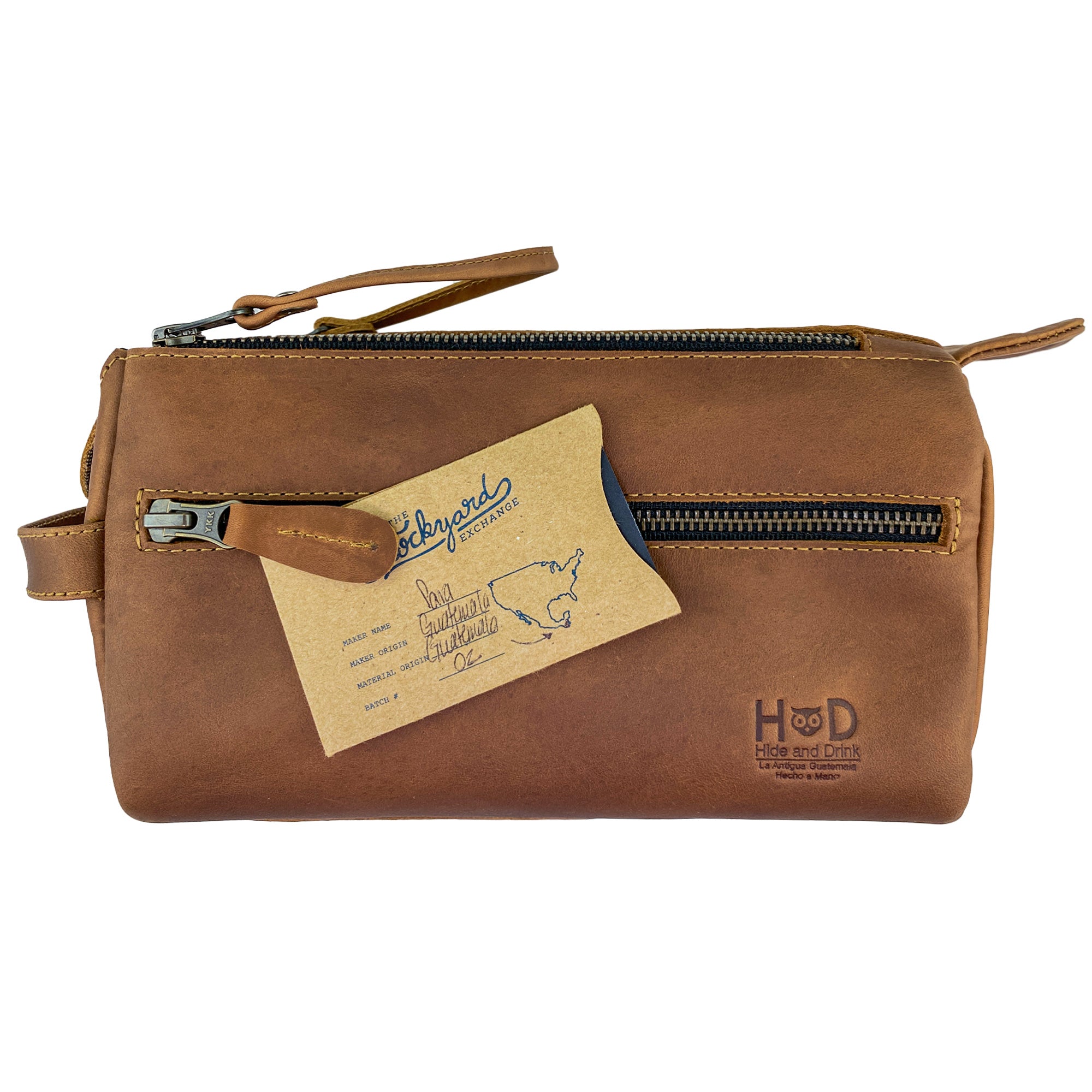 Close-up view of the tan Hide & Drink Toiletry Bag showcasing its detailed finish. This Full Grain Leather Toiletry Bag is a fashionable Hand Bag and a functional Dopp Kit Organizer for travel essentials. StockyardX, Handmade, S.