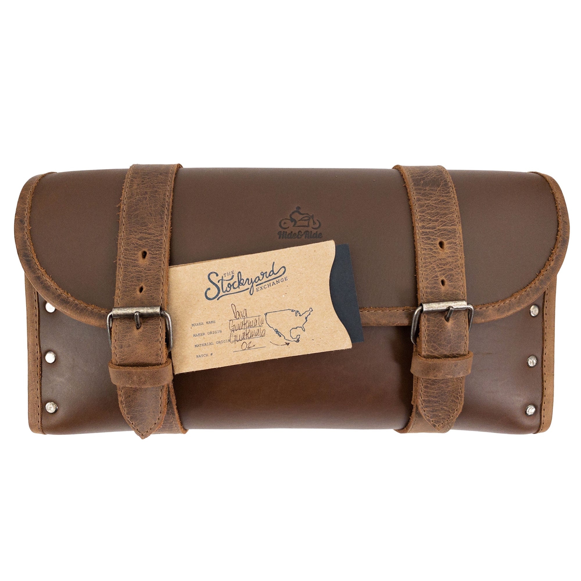 Riveted Bag for Motorcycle by Hide & Ride, featuring a stylish card displayed next to it, showcasing its artisan quality and design. This Motorcycle Riveted Bag is a fantastic biker accessory made from full grain leather with small batch production in La Antigua Guatemala & Oaxaca Mexico.