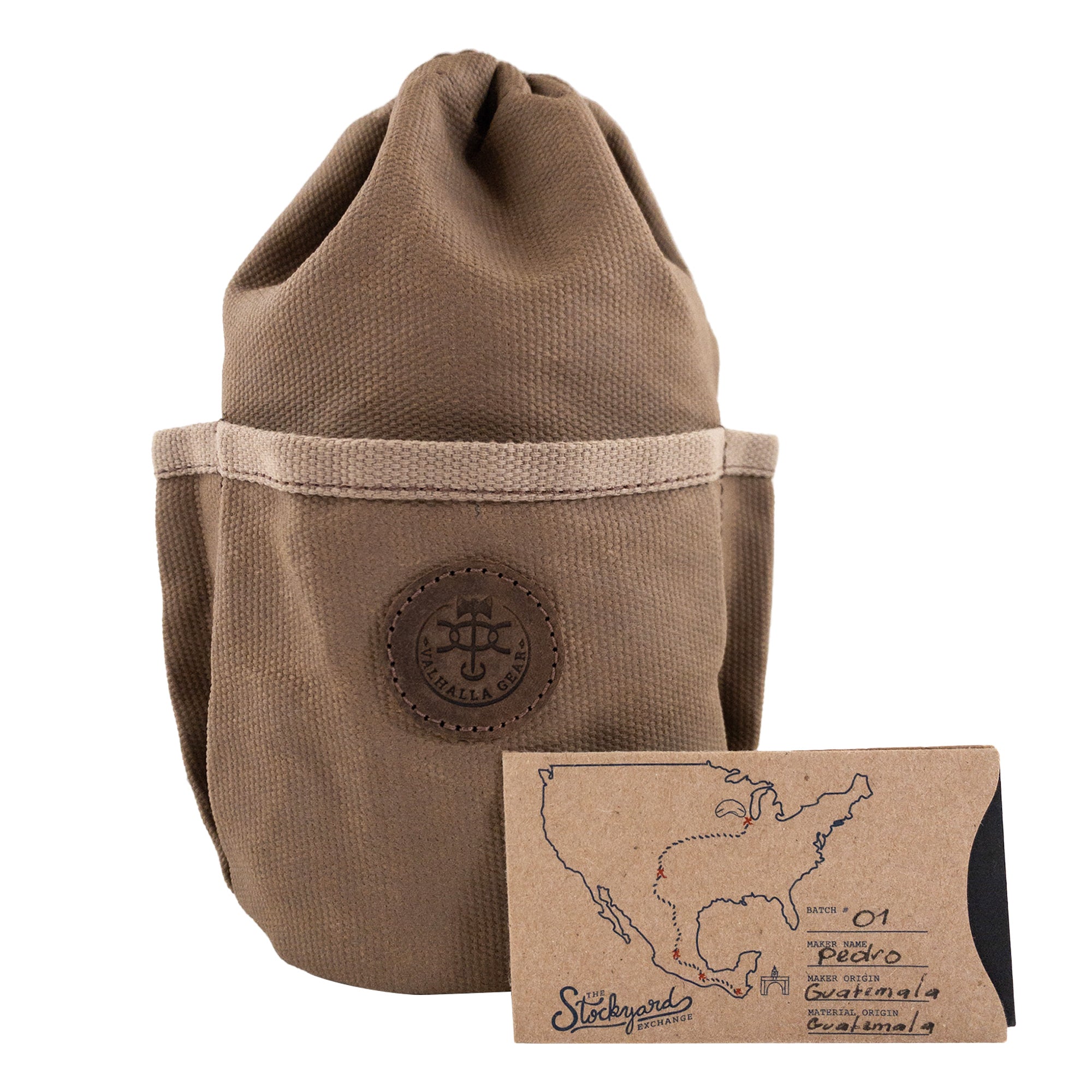 The Valhalla Gear Camping Bag for Water Bottle presented with a handmade tag showcasing its origin in La Antigua Guatemala. This camping bag, made from waxed canvas and full grain leather, emphasizes the artisan craftsmanship and small batch production.