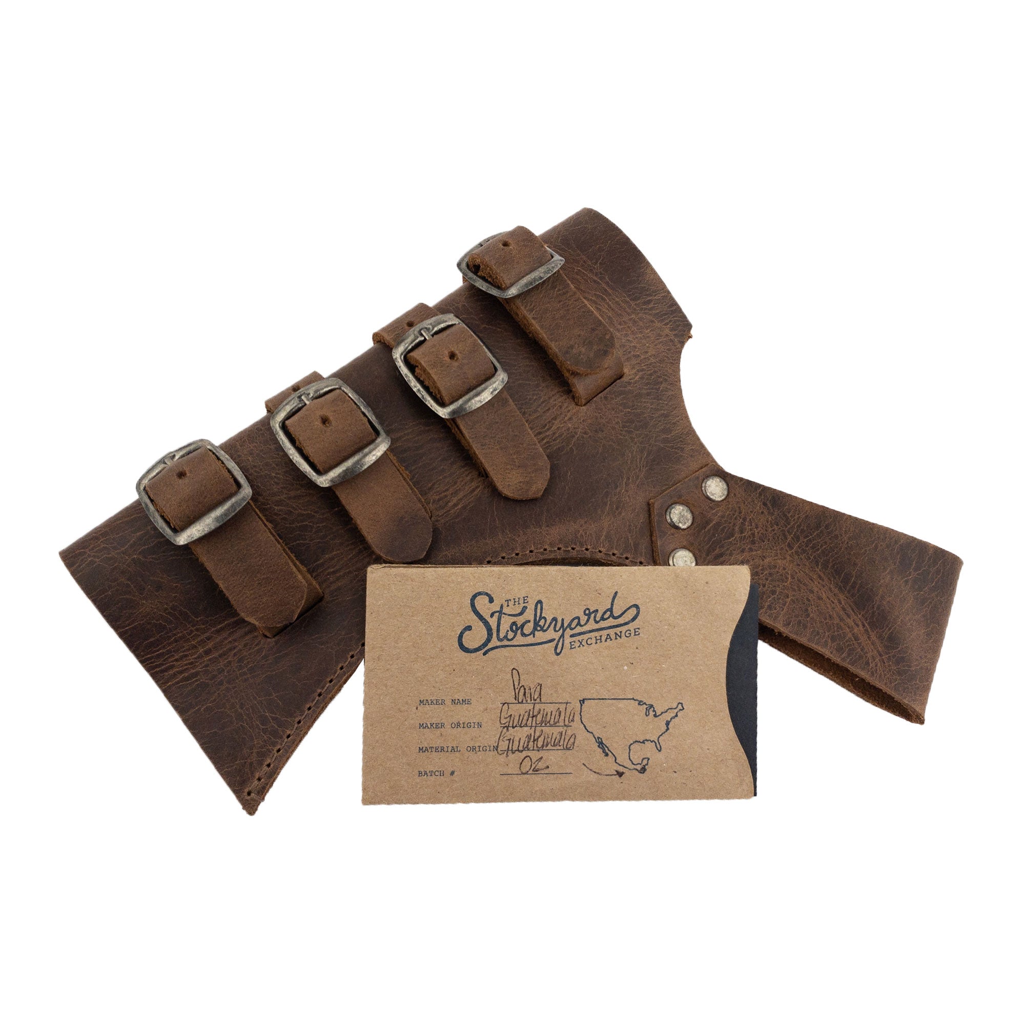 The Sword Frog Leather Holder by Hide & Play with its packaging, reflecting the quality assurance of an artisan product. This medieval costume accessory, crafted from full grain leather, demonstrates the small batch production ethos, hand cut and sewn in La Antigua Guatemala & Oaxaca Mexico.