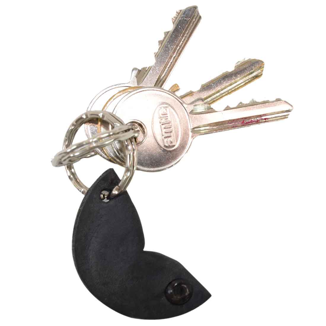 A sleek Fidget Cashew Keychain by Hide & Drink attached to keys, showcasing its unique design. This key holder doubles as a Good Luck Charm and is crafted from Full Grain Leather. The small batch production highlights the artisan nature, involving hand cut, hand sewn, and fire branded techniques from La Antigua Guatemala & Oaxaca Mexico.