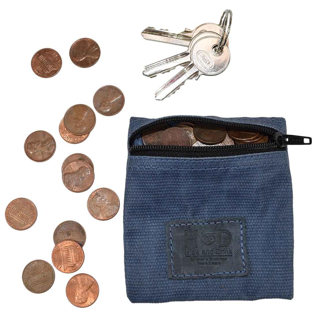 Hide & Drink Condom Pouch filled with coins and keys, made from robust water resistant waxed canvas. This multifunctional pouch makes a perfect classic partner gift and travel essential. Handmade in La Antigua Guatemala showcases exceptional artisan craftsmanship.