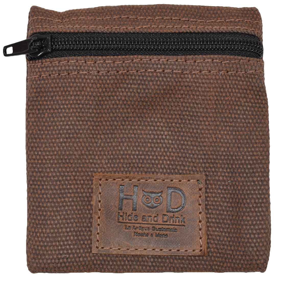 Hide & Drink Condom Pouch highlighted against a neutral background, made from premium water resistant waxed canvas. Perfect for every day use, this classic partner gift is a great travel essential. Handmade in La Antigua Guatemala ensures small batch quality and artisan skills.