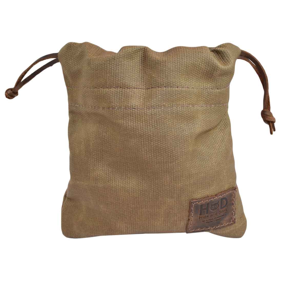 The Hide & Drink Golf Pouch, a beautifully crafted waxed canvas pouch in light brown. Great for keeping golf essentials organized in your bag or for various uses around the home. Waxed Canvas Golf Valuables Field Pouch, Golf Bag, Sport Organizer, Multipurpose Pouch with String, StockyardX, Small Batch Production, Hand Cut, Hand Sewn, Fire Branded, Artisan, Handmade in La Antigua Guatemala & Oaxaca Mexico.