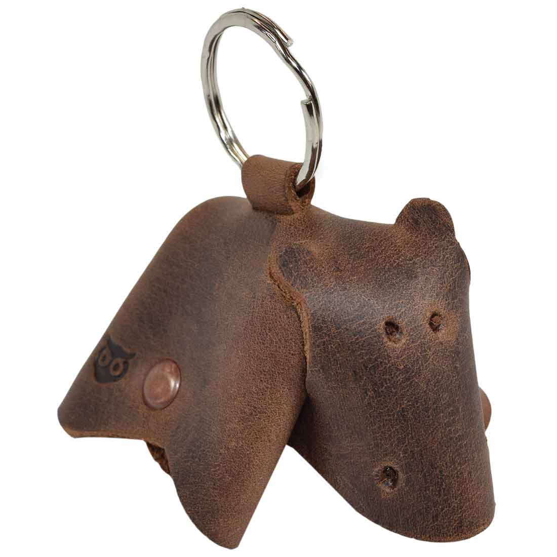 Beautiful Full Grain Leather Animal Key Chain from Hide & Drink, featuring a cozy cow design. This Critter Keychain makes a lovely fob charm and a creative animal key holder charm pendant, showcasing artisan craftsmanship from La Antigua Guatemala.
