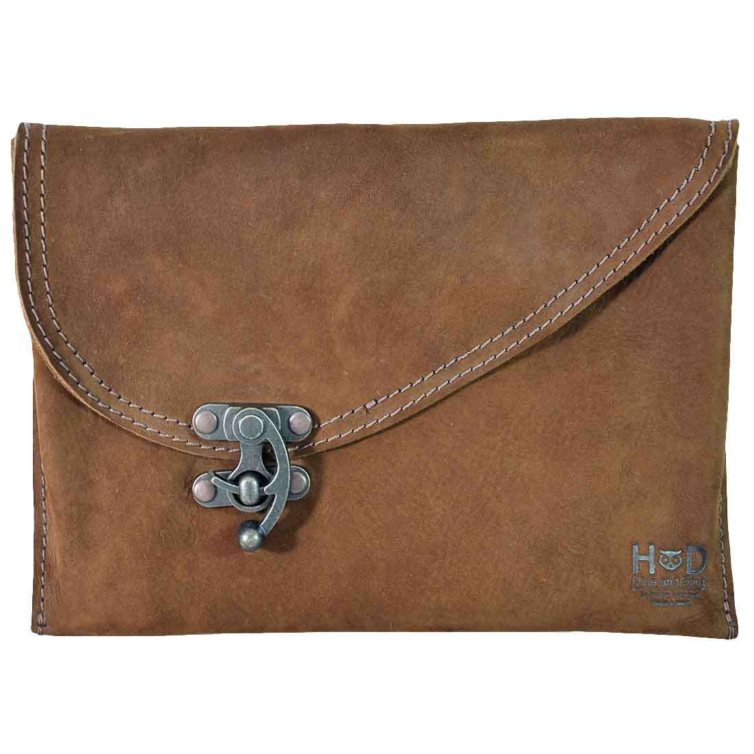 Brown Vintage Clutch Bag from Hide & Drink, featuring a distinct vintage clasp and crafted from Full Grain Leather, embodying the artisan spirit of small batch production in La Antigua Guatemala.