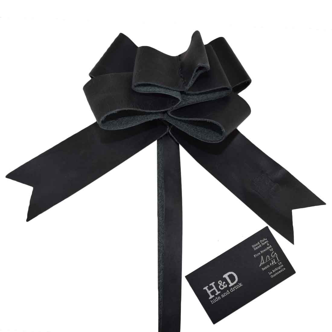 Elegant Black Ribbon Decor by Hide & Drink featuring a handcrafted Bow Wrap for Christmas. Made from premium Full Grain Leather, this artisan piece represents small batch production with hand cut and hand sewn craftsmanship made in La Antigua Guatemala and Oaxaca Mexico.