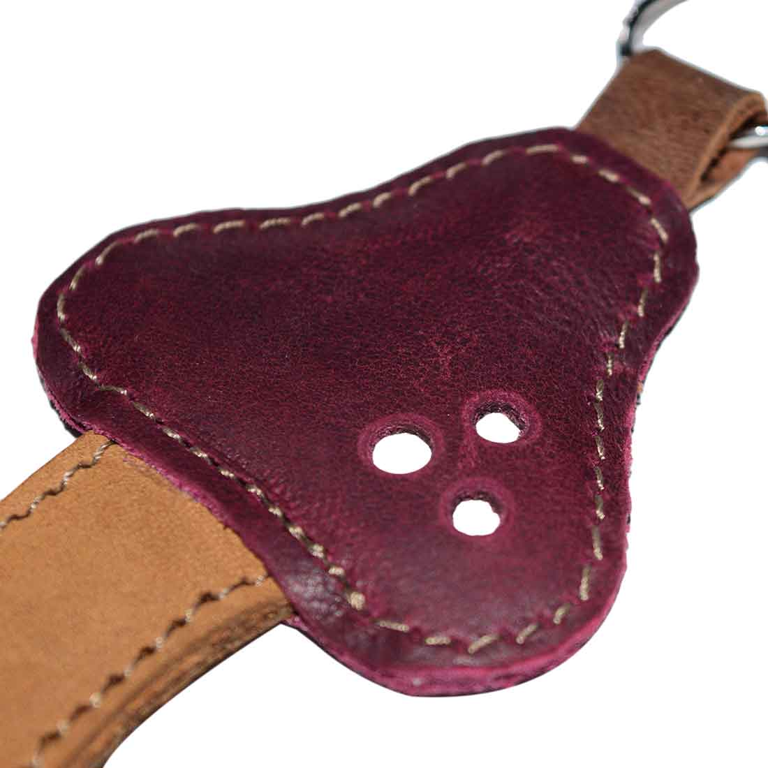 Detailed shot of the Red Mushroom Keychain by Hide & Drink highlighting the exquisite leather texture and stitching. This accessory made from Full Grain Leather is an example of StockyardX's small batch production. Hand cut, hand sewn, and fire branded, this artisan item is proudly handmade in La Antigua Guatemala & Oaxaca Mexico.