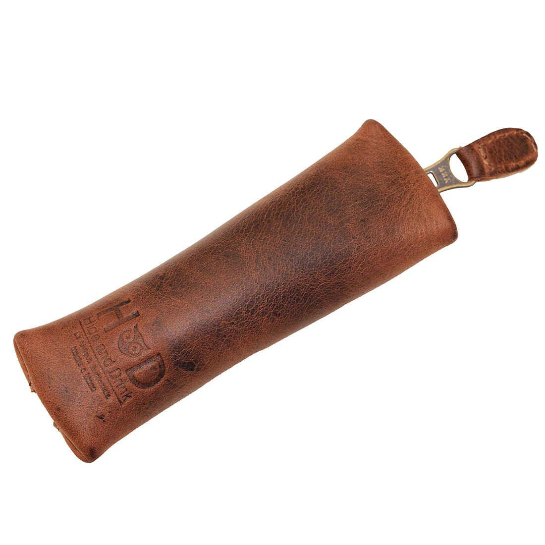 Hide & Drink's Long Coin Organizer laid flat, exhibiting its unique branding and craftsmanship. This durable Long Coin Case and Cash Holder are also a charming Rustic Case for Pennies, making it a great Vintage Zippered Pouch. Made of full grain leather, it reflects Small Batch Production qualities with its Hand Cut and Hand Sewn features, Fire Branded for uniqueness, crafted by artisans in La Antigua Guatemala & Oaxaca Mexico.