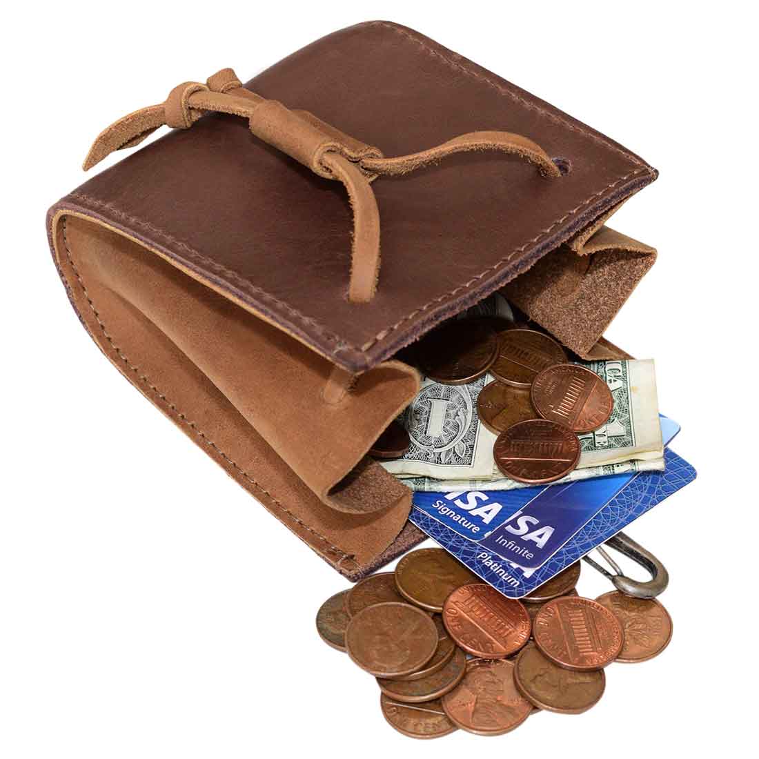 An open Hide & Drink Old Fashion Coin Case filled with coins and cash, demonstrating its practical use. This full grain leather wallet combines functionality with classic vintage style, making it a great accessory for anyone. Old Fashion Coin Case Wallet Cash Bag Pouch Classic Vintage Accessories, Full Grain Leather, StockyardX, Small Batch Production, Hand Cut, Hand Sewn, Fire Branded, Artisan, Handmade in La Antigua Guatemala & Oaxaca Mexico.