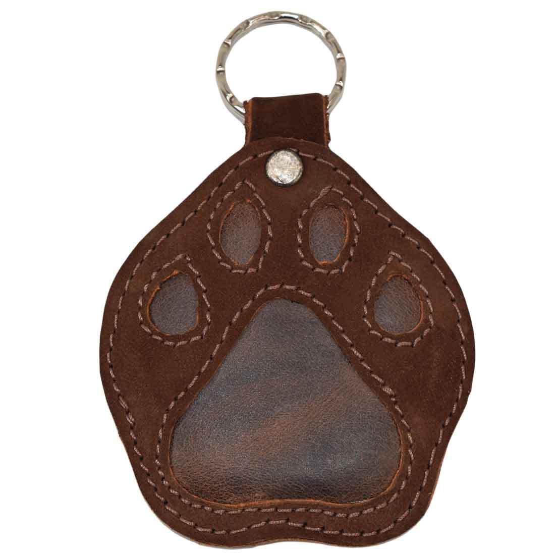 Front view of the Hide & Drink Doggy Paw Keychain highlighting the durable high-quality suede leather. Ideal for dog lovers, this keychain combines fun design with craftsmanship, featuring tags like Full Grain Leather, Handmade in La Antigua Guatemala & Oaxaca Mexico. A perfect gift for any occasion.