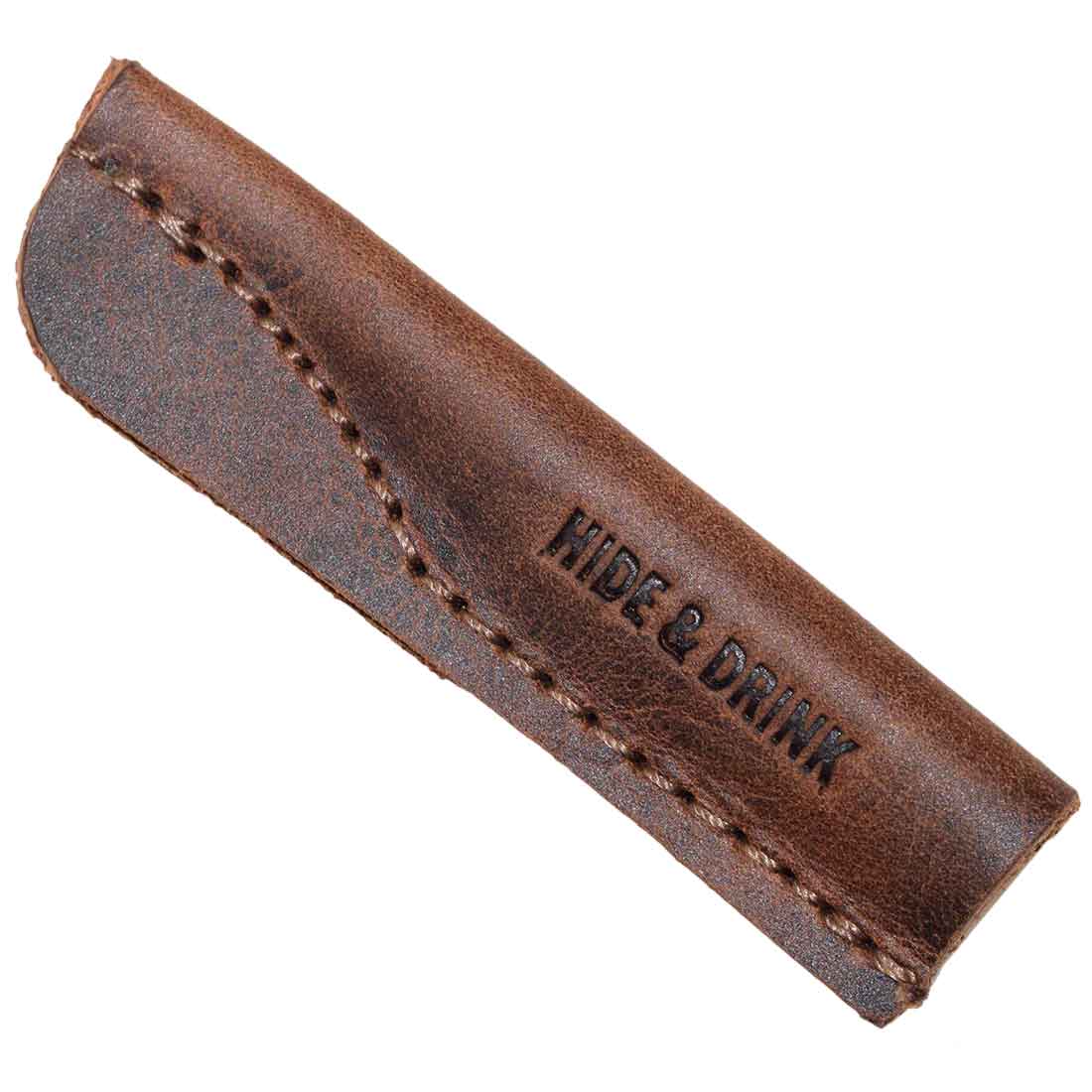 Detailed view of a single Hide & Drink Pencil Cap (6 Pack) showcasing the hand-branded logo on luxurious full grain leather. Ideal pencil lead protectors, these caps reflect artisan craftsmanship and are handmade in La Antigua Guatemala & Oaxaca Mexico.