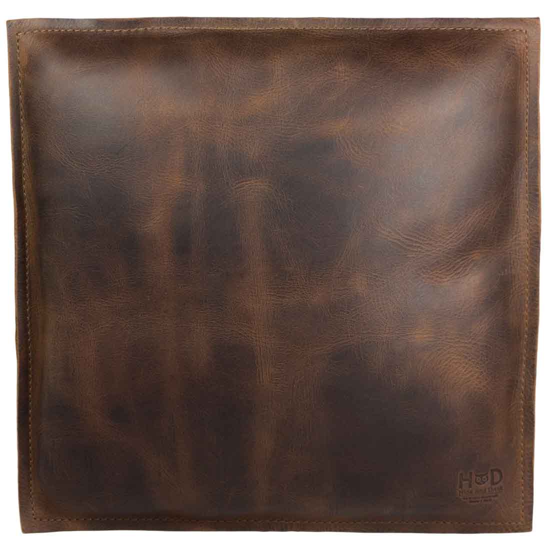 Artisan-crafted Hide & Drink Decorative Pillow made from full grain leather, a stylish 12 x 12 in. accent for your couch, sofa, or bed. This decorative piece enhances your home and office accessories, honoring small batch production principles, hand cut, hand sewn, and fire branded by skilled artisans in La Antigua Guatemala & Oaxaca Mexico.
