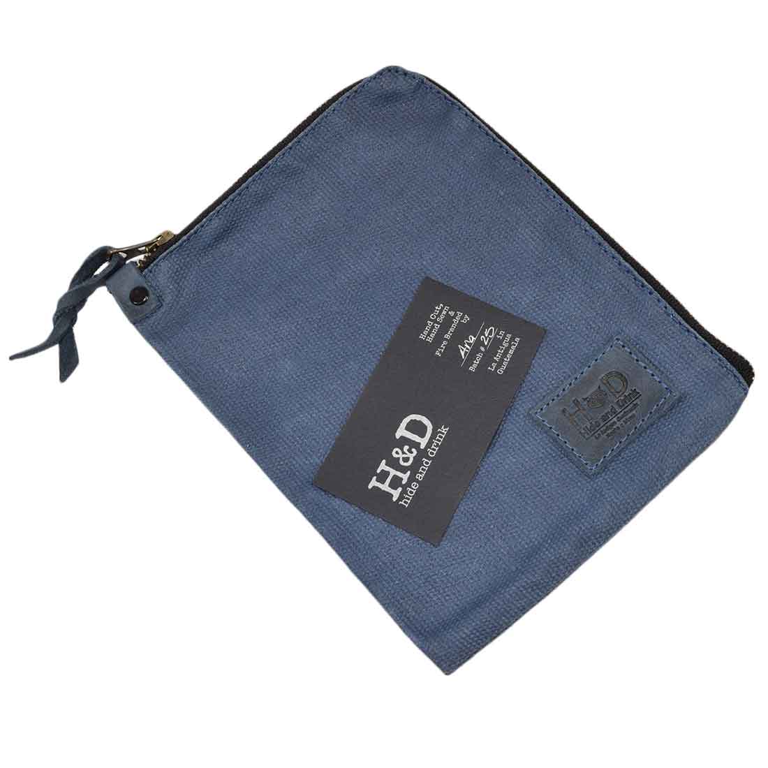 Side view of the light navy Scribbler Case from Hide & Drink, showcasing Waxed Canvas. Ideal for notebook storage, emphasizing artisan quality and small batch production. Handmade in La Antigua Guatemala & Oaxaca Mexico.