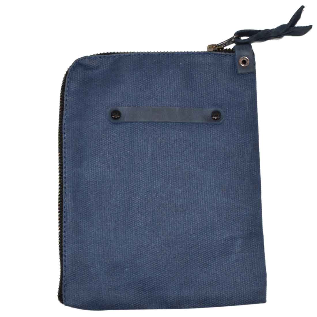 Scribbler Case in a light navy tone by Hide & Drink, made from Waxed Canvas. Designed for notebooks, emphasizing small batch production, hand cut, hand sewn, and artisan craftsmanship. Handmade in La Antigua Guatemala & Oaxaca Mexico.
