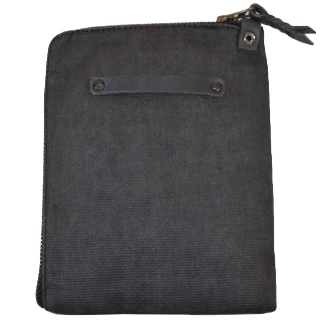 Scribbler Case in navy blue by Hide & Drink, made from Waxed Canvas. Designed for notebooks, emphasizing small batch production, artisan craftsmanship, and fire-branded quality. Handmade in La Antigua Guatemala & Oaxaca Mexico.
