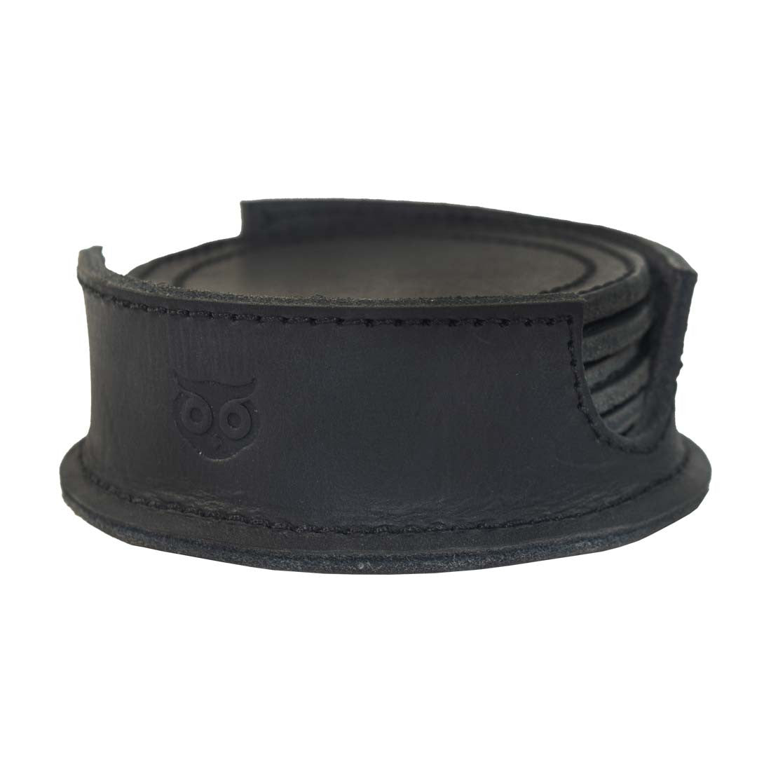 Thick Leather Coasters (6-Pack) by Hide & Drink, displayed in a holder, showcasing a stylish charcoal black design of circular coasters made from premium full grain leather. These artisan pieces undergo small batch production, are hand cut, hand sewn, and fire branded, proudly handmade in La Antigua Guatemala.