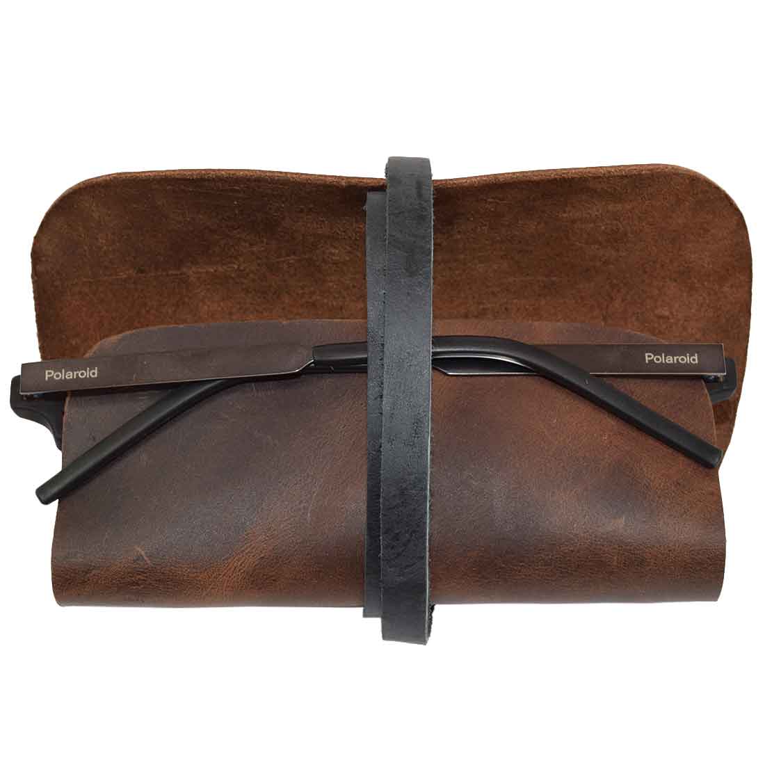 Hide & Drink Sunglass Wrap features a chic design designed to store sunglasses securely. Made from soft, full grain leather, this eye glasses storage is perfect for travel. Artisan crafted in La Antigua Guatemala, it is hand cut, hand sewn, and fire branded for lasting quality.