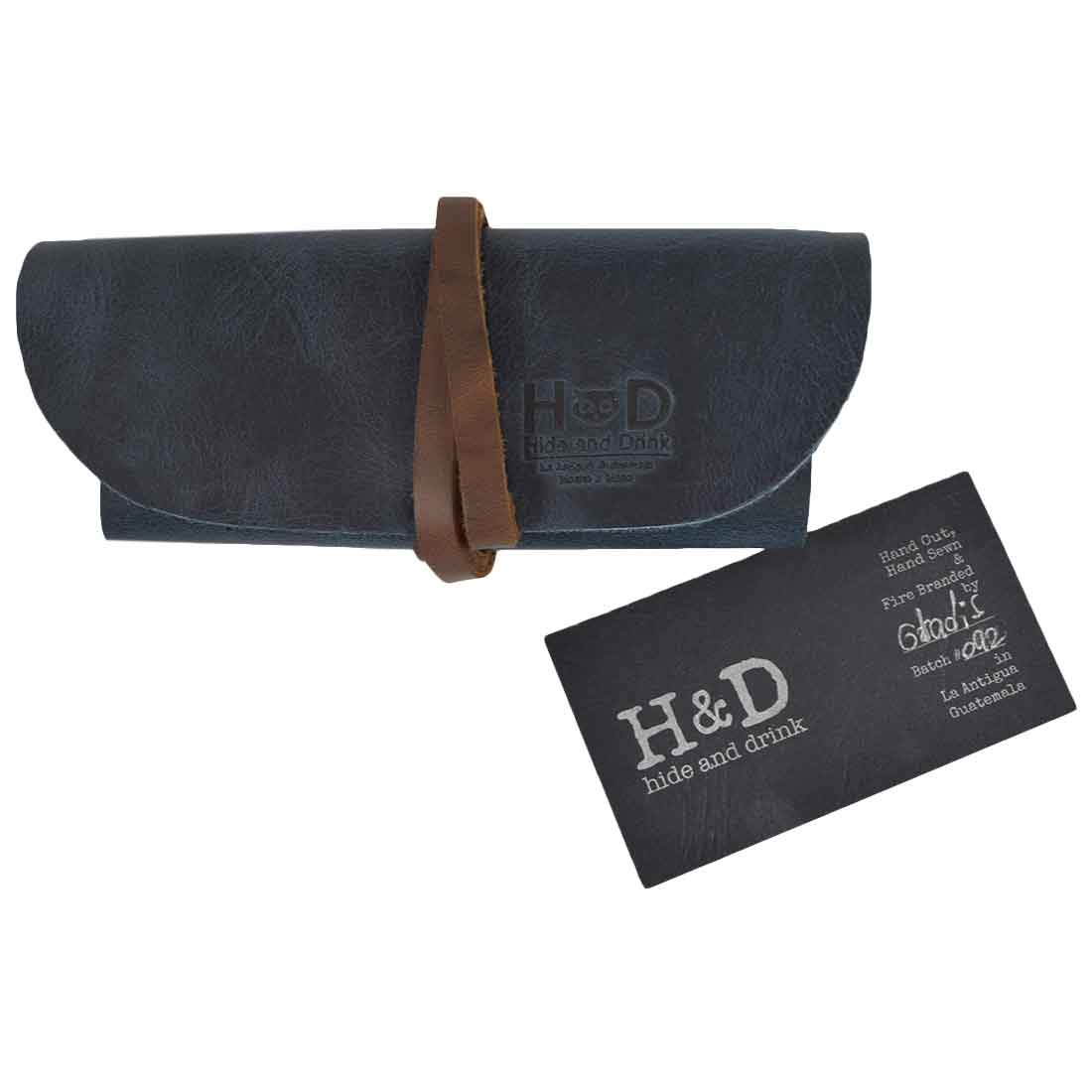 Hide & Drink Leather Sunglass Wrap is a chic accessory for storing your sunglasses securely. Made from full grain leather, it serves as an eye glasses storage solution perfect for travel, showcasing artisan quality.