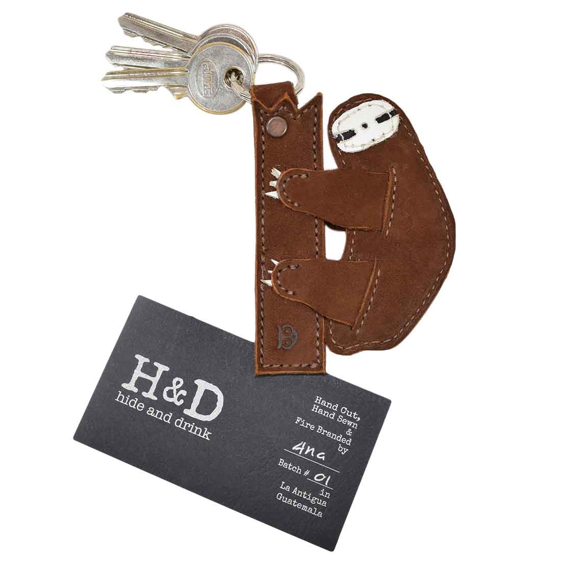 Back view of the sloth Critter Key Chain from Hide & Drink, highlighting its premium materials. This delightful Animal Key Ring Holder is crafted from Full Grain Leather, ideal for anyone who appreciates artisan design. Handmade in La Antigua Guatemala & Oaxaca Mexico.