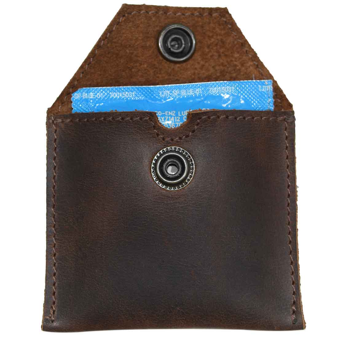 Hide & Drink Tampon Case open to reveal space for a condom, showcasing its versatility as a discreet storage pouch. This artisan product highlights small batch production and quality leather workmanship from Oaxaca Mexico.